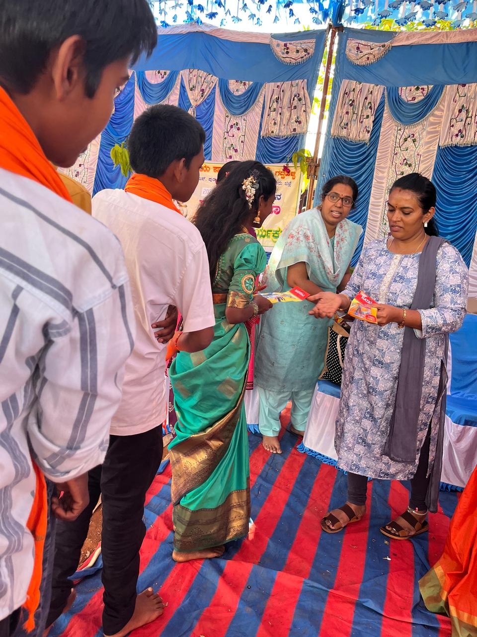 Donation of stationery for students of happy school.